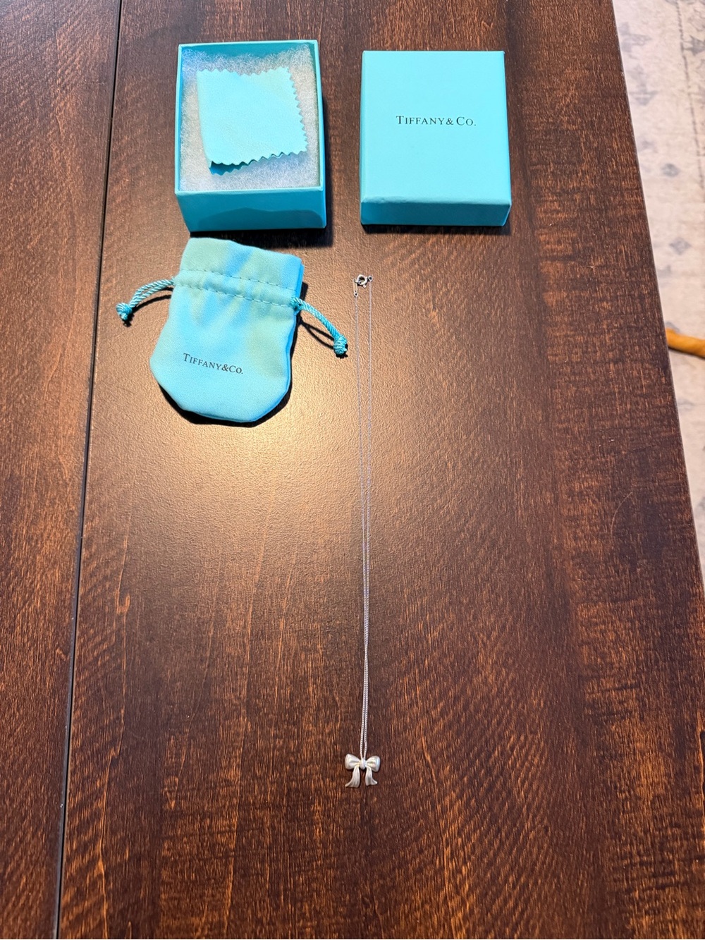 Tiffany & Co. Silver Bow Necklace with Signature Blue Pouch and Box